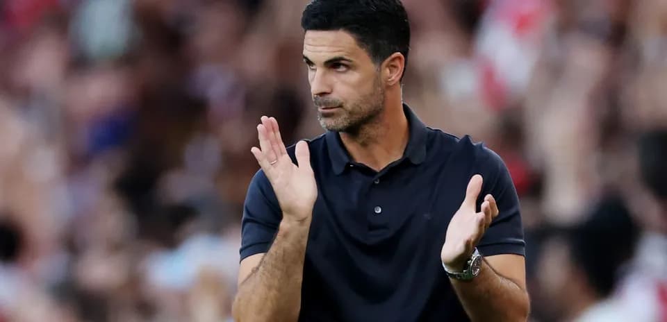 Coach applauding during a match on the sideline