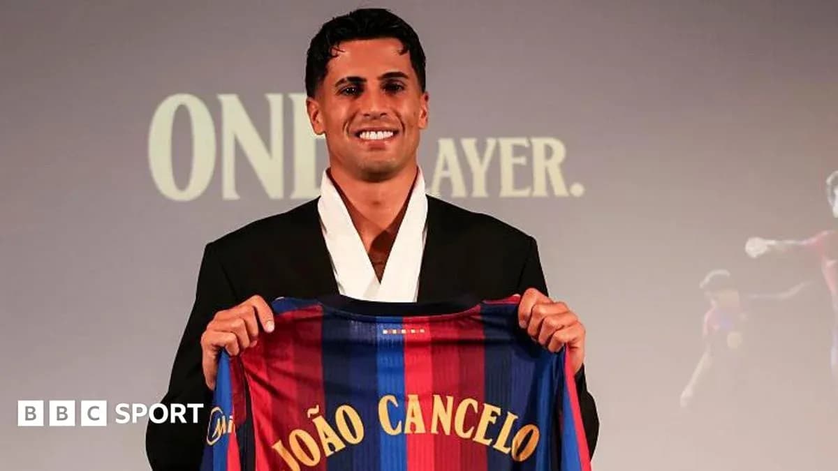 Player holding FC Barcelona jersey during presentation