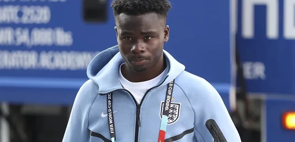 Player arriving at venue in team tracksuit