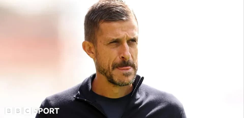 Coach looking thoughtful during training session