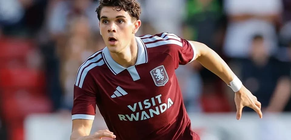 Player in maroon kit sprinting during match