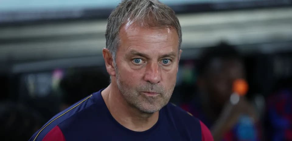 Coach observing from the sidelines during match