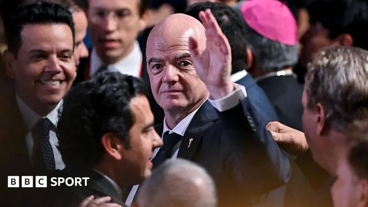 Man waving at a crowded event with attendees