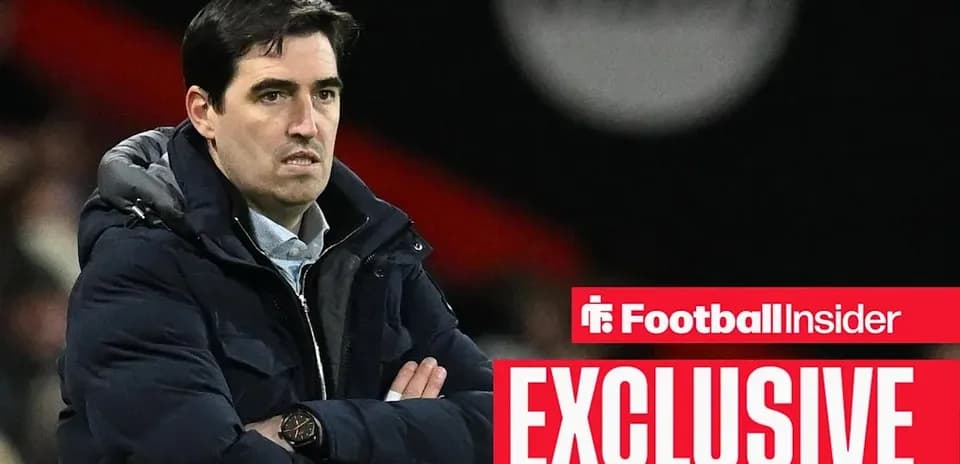 Manager with crossed arms during match observation