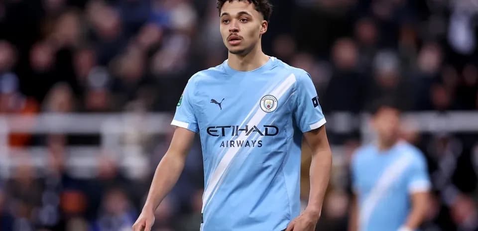Player wearing Manchester City kit on the field