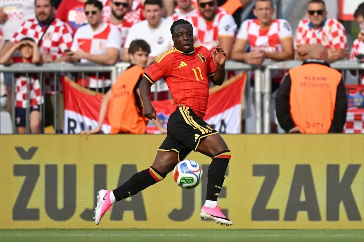 Belgian player running with ball during match