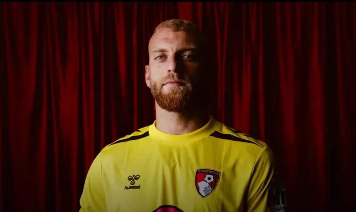 Goalkeeper wearing yellow jersey with AFC Bournemouth badge