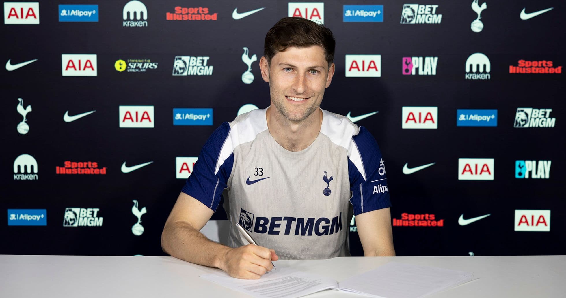Player signing contract at Tottenham Hotspur press conference