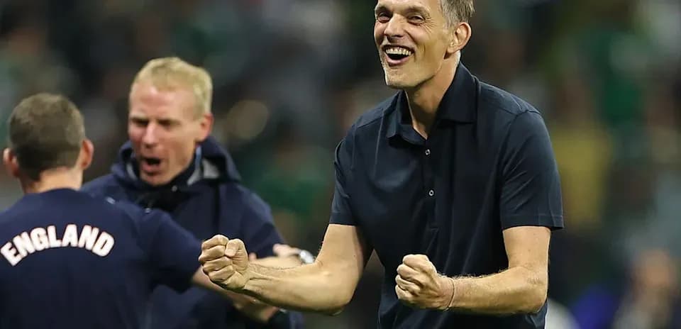 Coach celebrating a victory with staff members