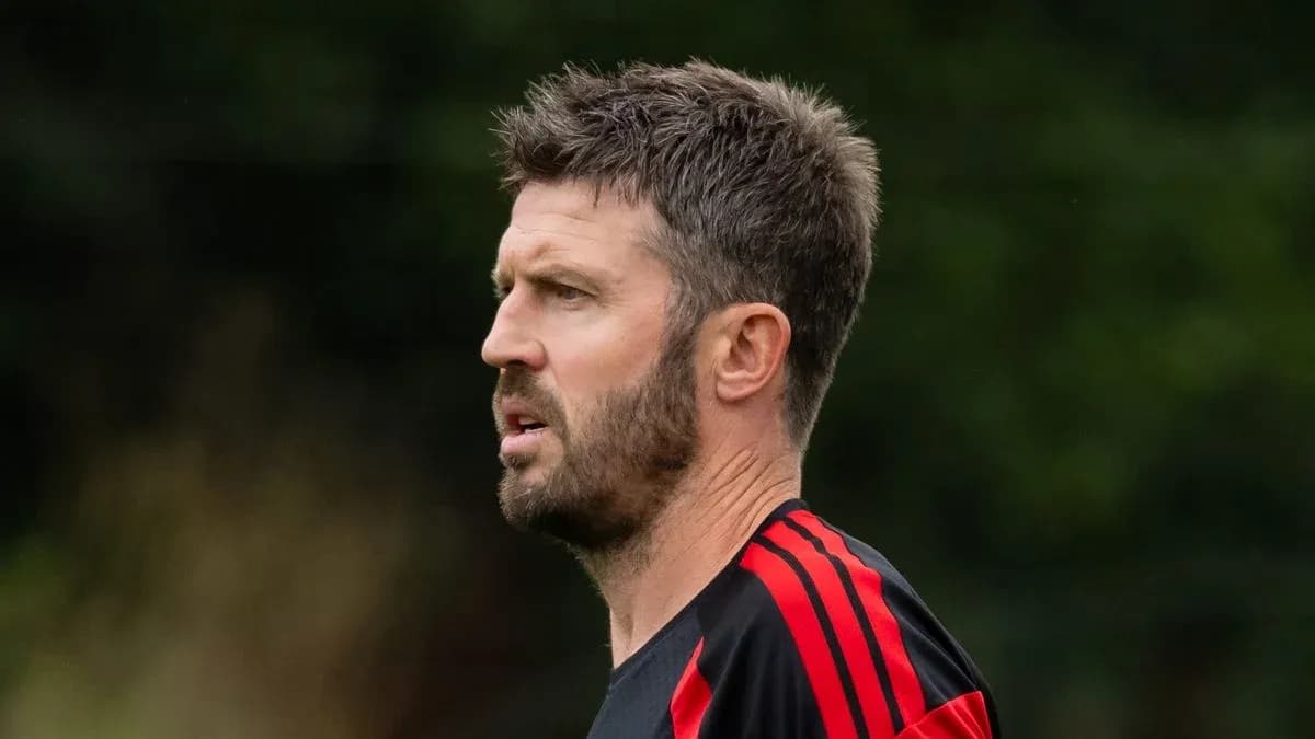 Coach observing players during training session