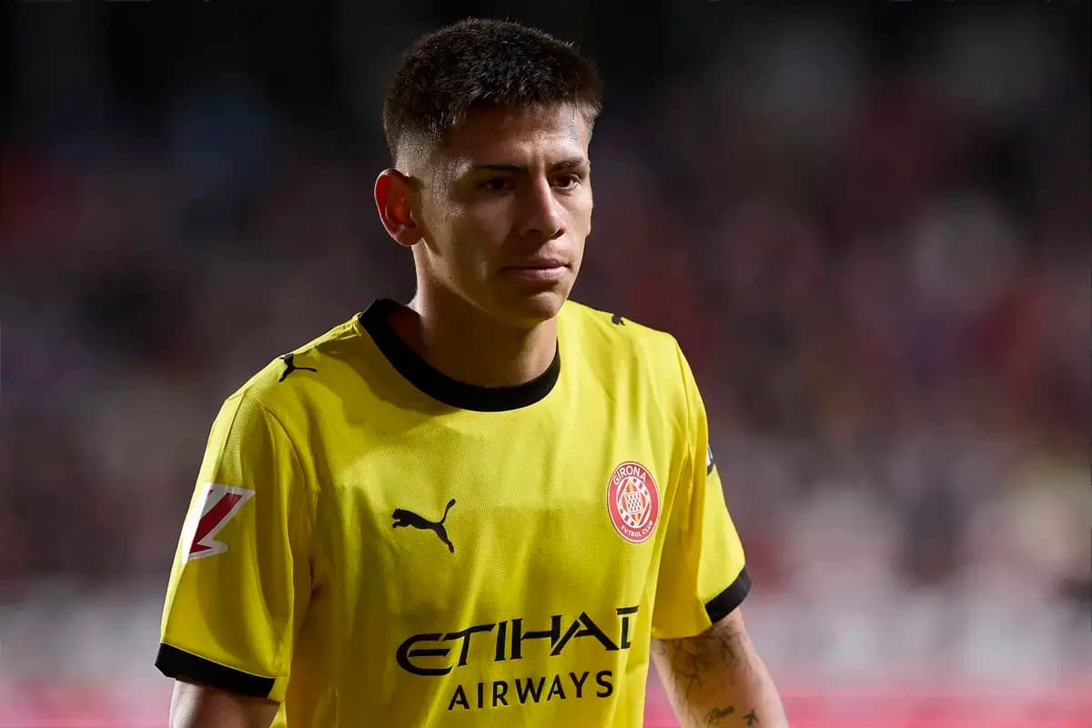Player in yellow jersey walking on the pitch