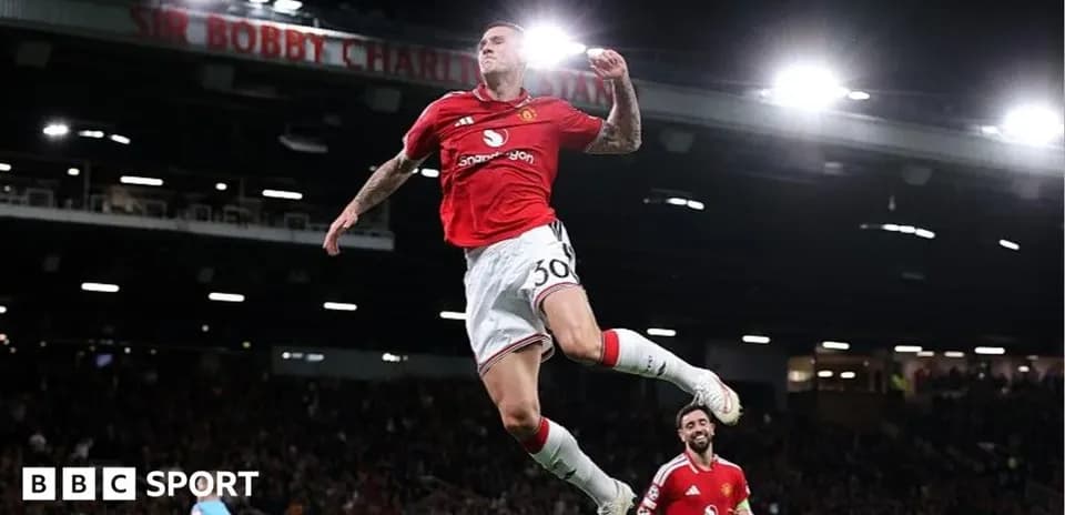 Player celebrating goal at Old Trafford stadium
