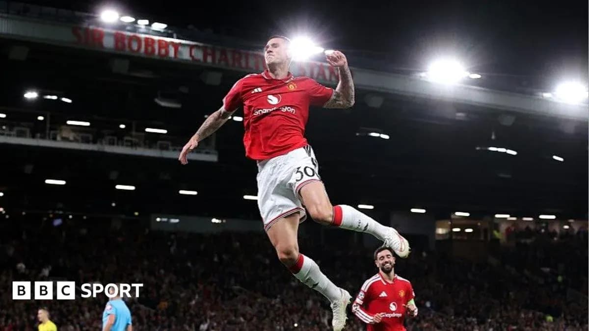 Player celebrating goal at Old Trafford stadium