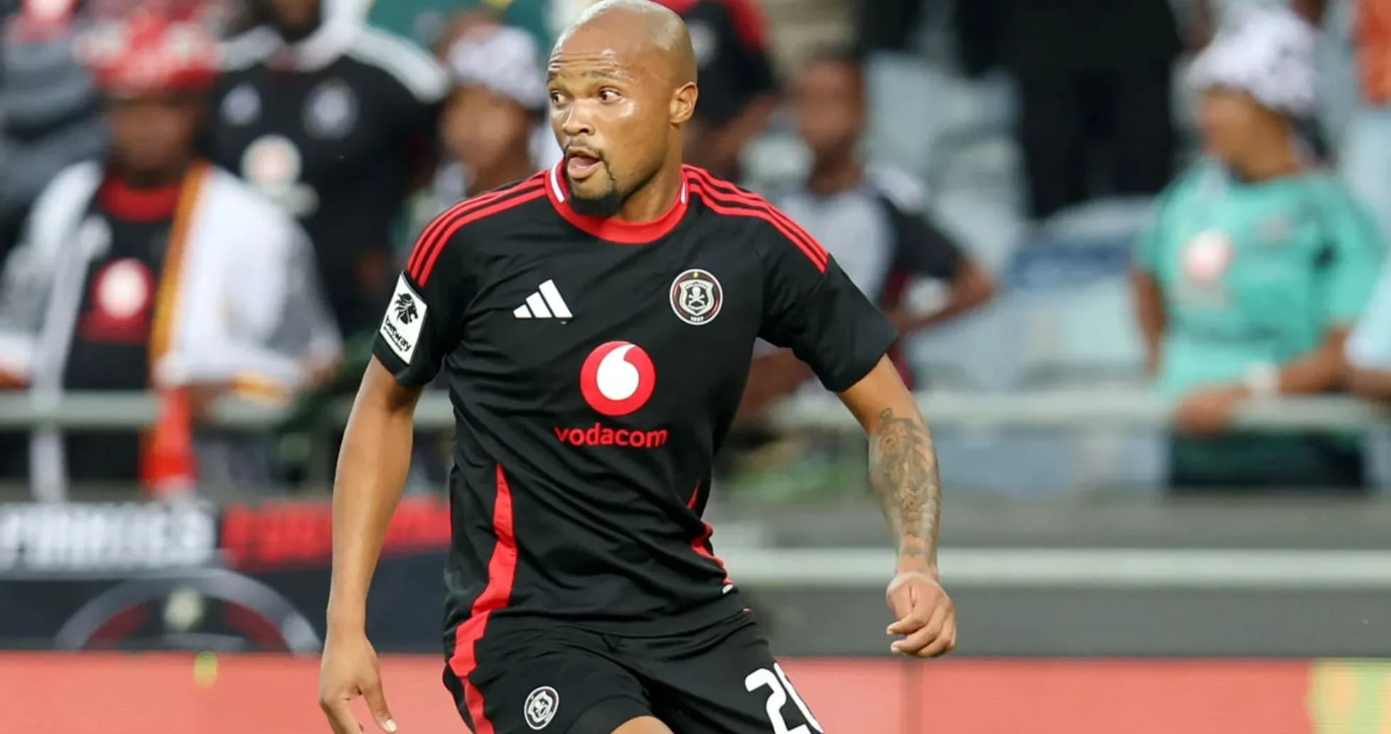Player in black jersey during a football match