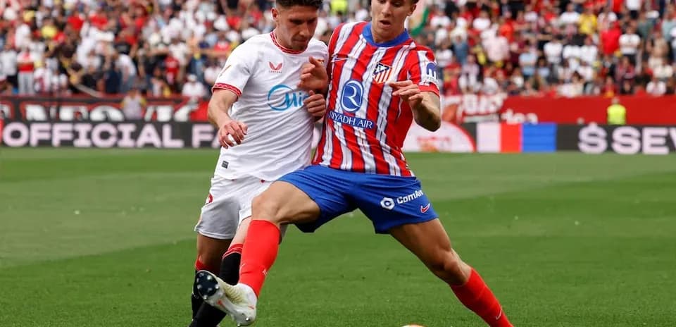 Sevilla and Atletico Madrid players contesting the ball