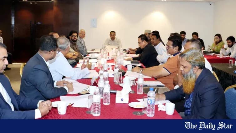Group of people in a meeting around a table