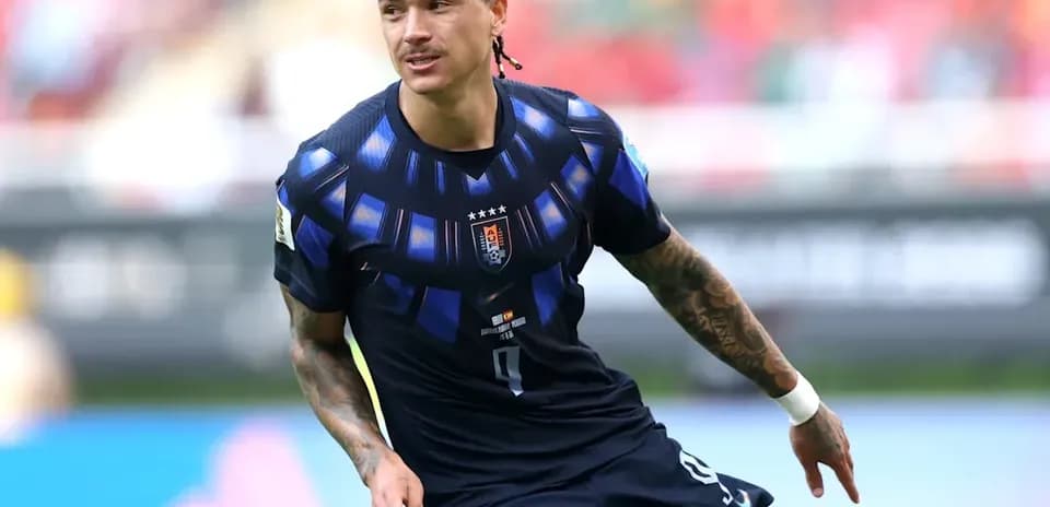 Player in blue jersey running on the field