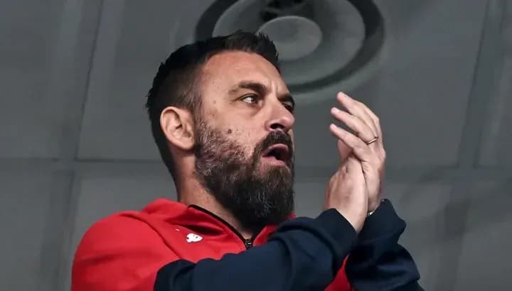 Man clapping in a sports venue