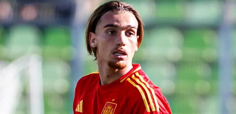 Player in red Spain jersey on the field