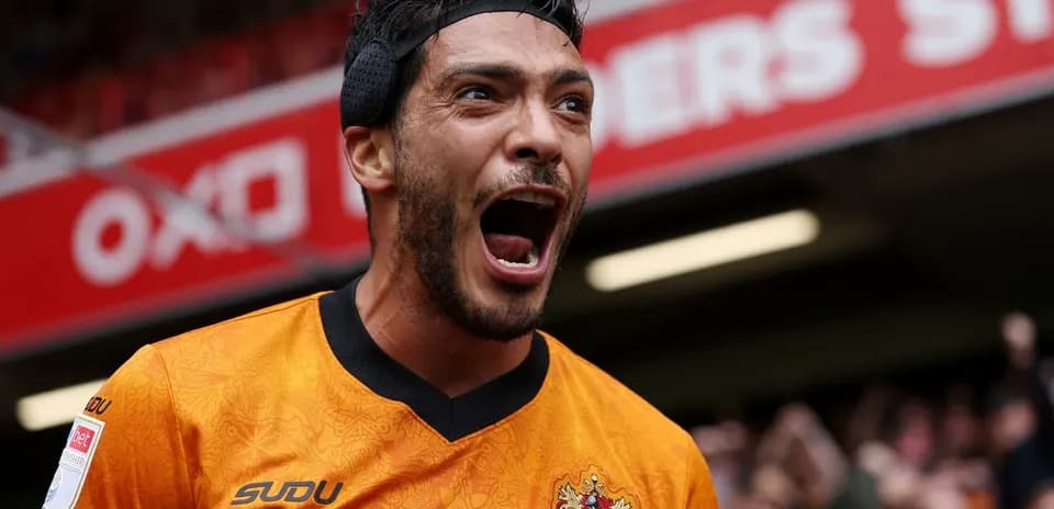 Player celebrating with arms raised in excitement