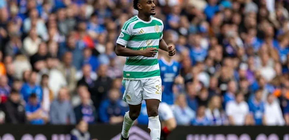 Player in Celtic kit running on the pitch