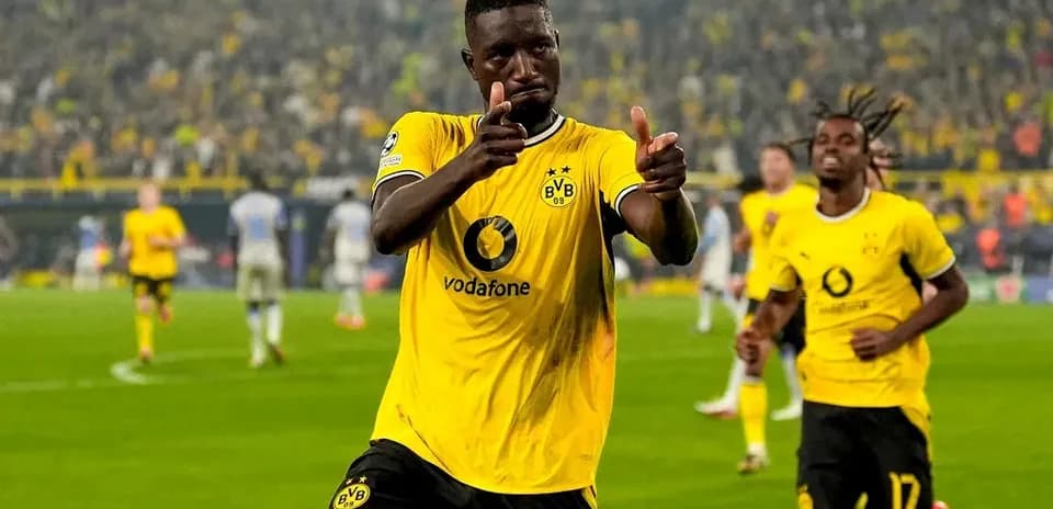 Player celebrating a goal in Borussia Dortmund jersey