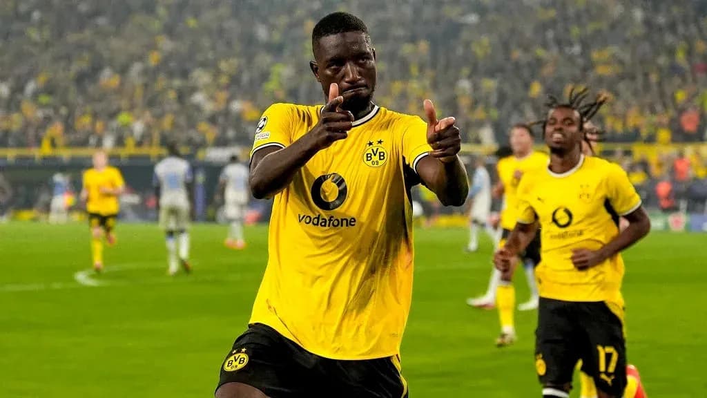 Player celebrating a goal in Borussia Dortmund jersey