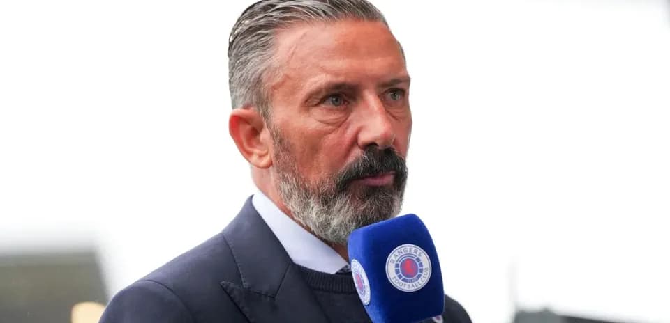 Man speaking into a microphone at event