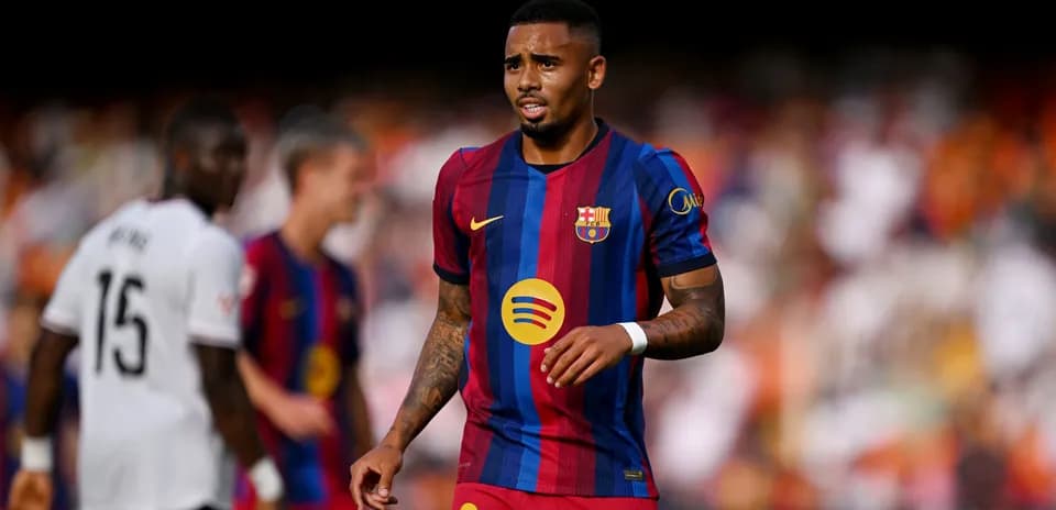 Barcelona player walking on pitch during match