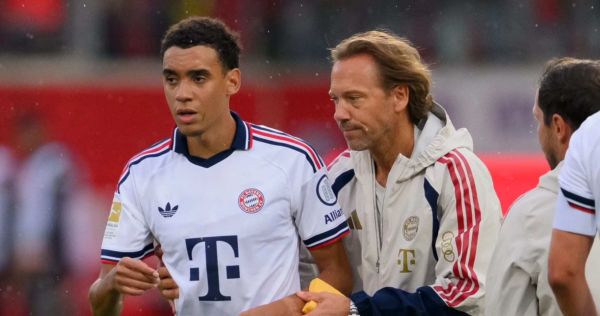 Player and coach discussing during match warm-up