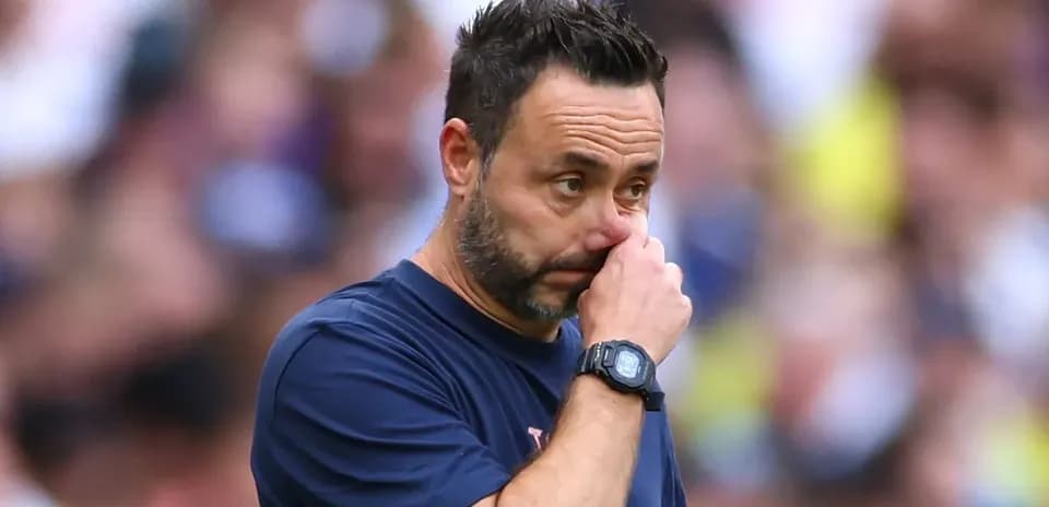Coach touching his face during a match