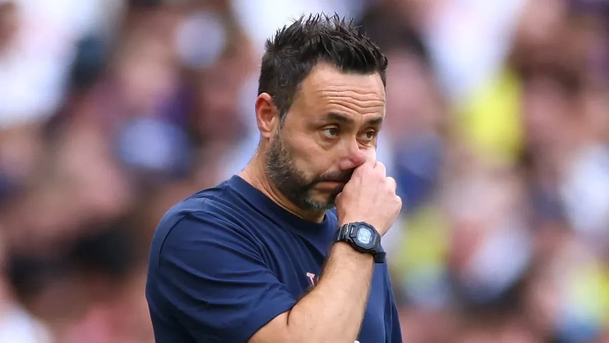 Coach touching his face during a match