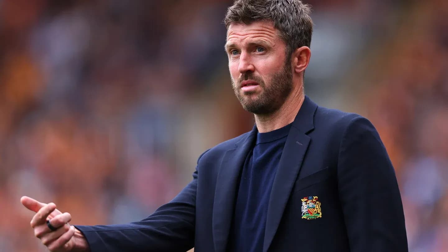 Coach gesturing during a football match on sideline