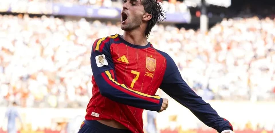 Player celebrating a goal in Spain national team jersey