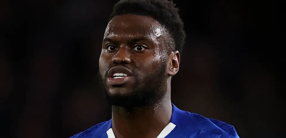 Player wearing blue kit during match action