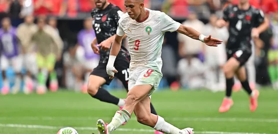 Moroccan player striking the ball during match