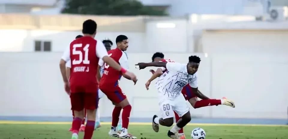Dibba Al Fujairah U23 player dribbling past defenders