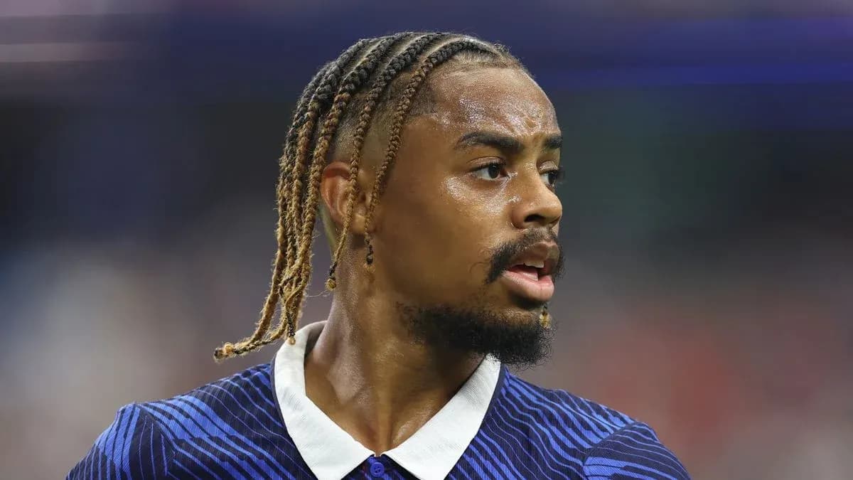 Player with braided hair during match action