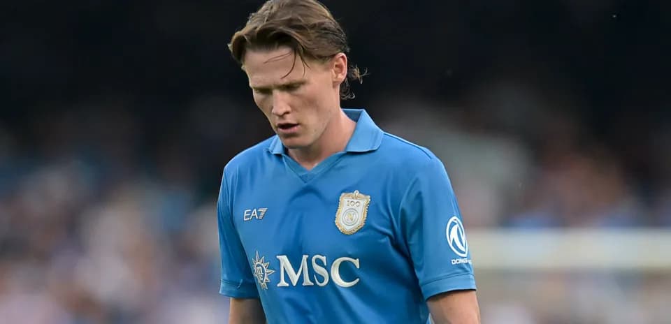 Player in blue jersey looking down during match