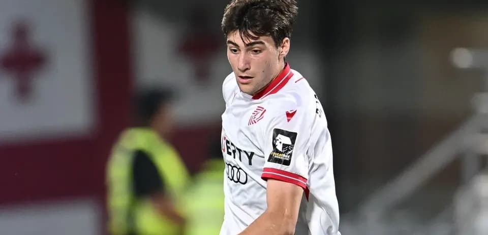 Player in white jersey during a soccer match