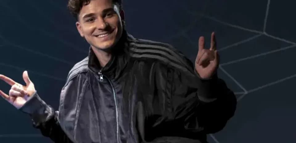 Person smiling and making hand gestures