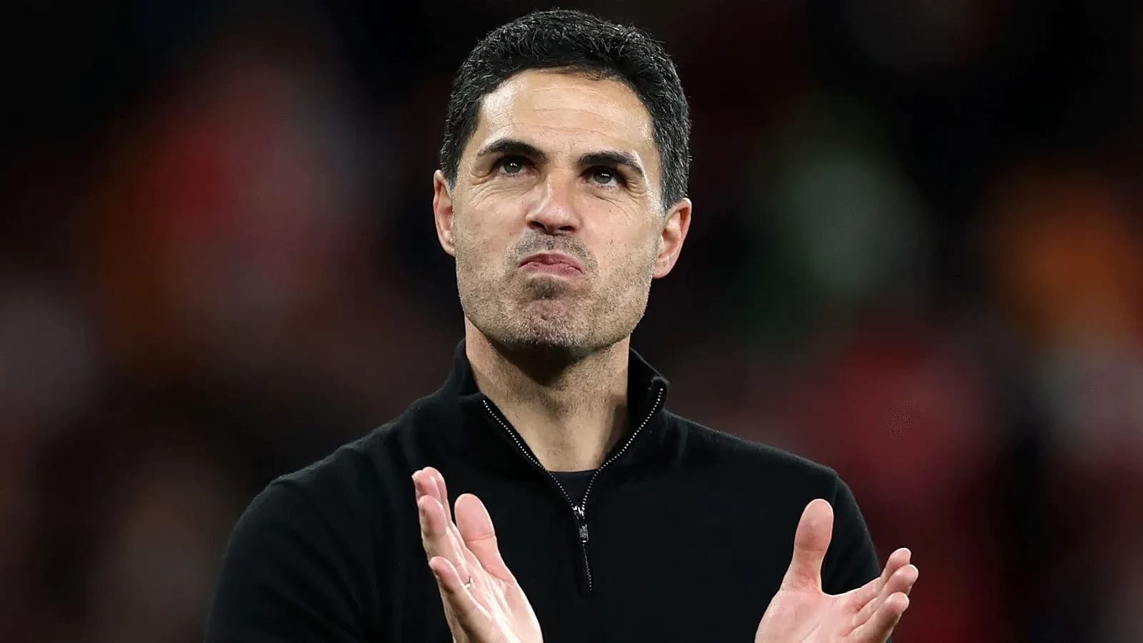 Manager clapping during match celebration
