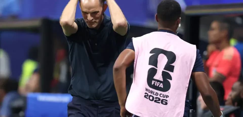 Coach with hands on head during match moment