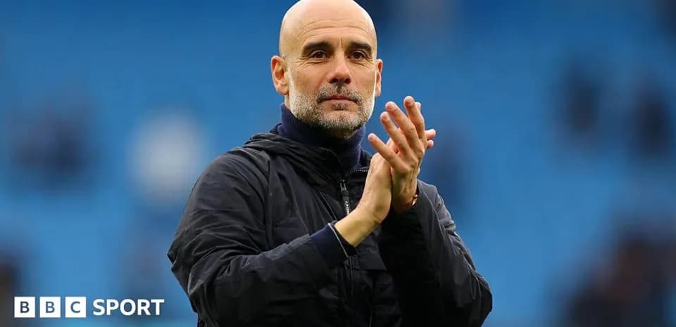 Manager clapping to fans at the stadium