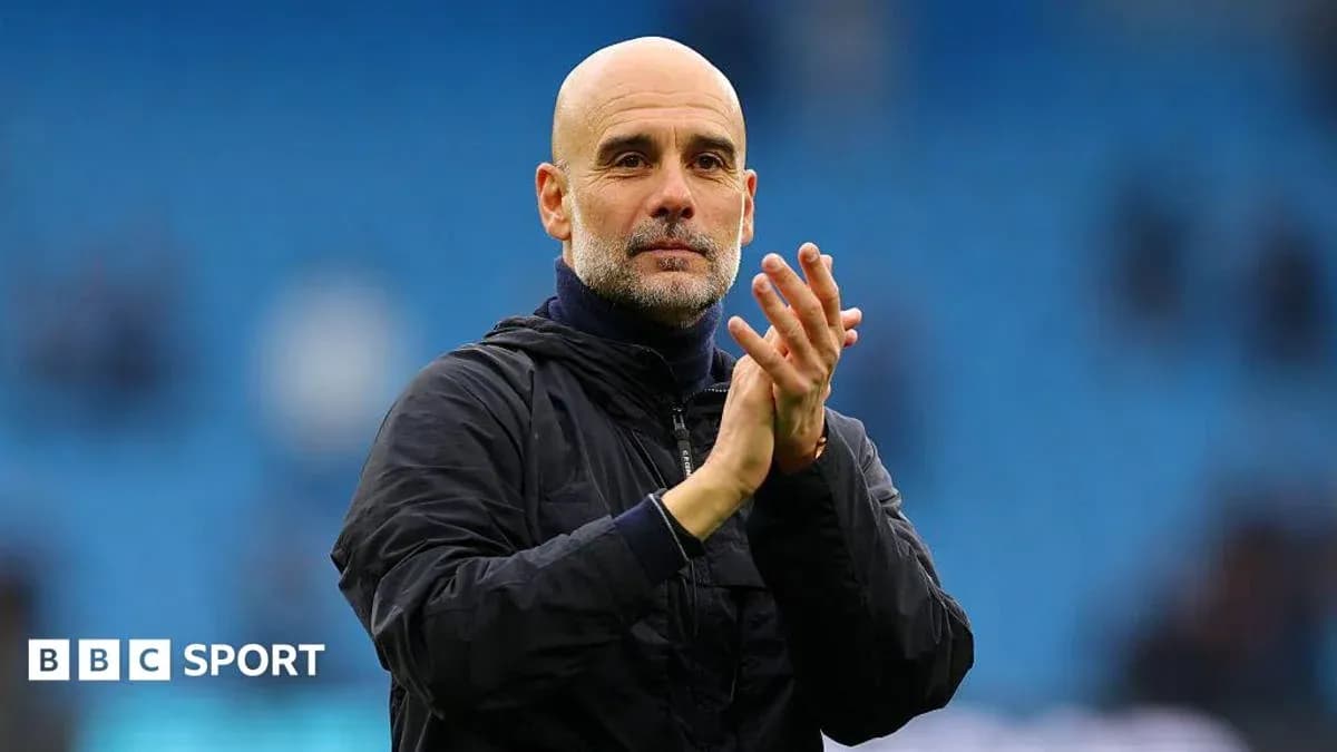Manager clapping to fans at the stadium