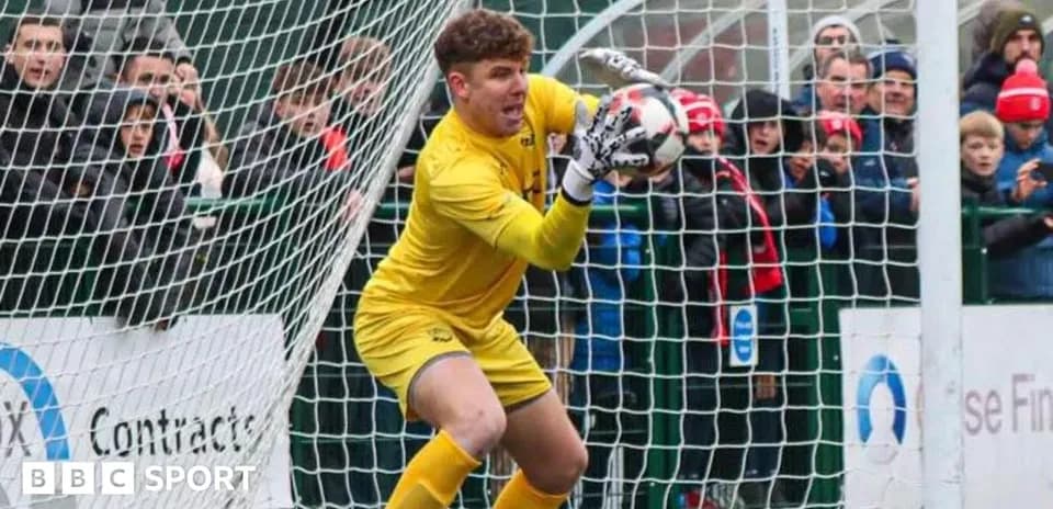 Goalkeeper catching the ball during a match