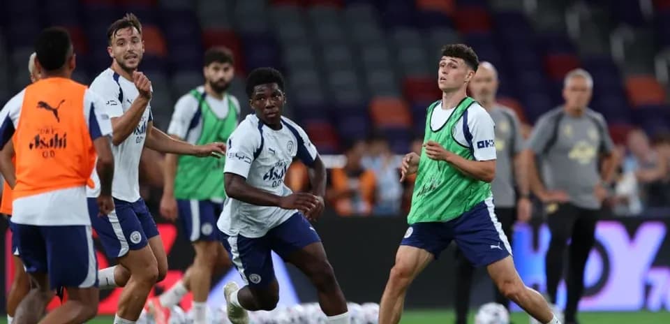 Players training and passing the ball on field