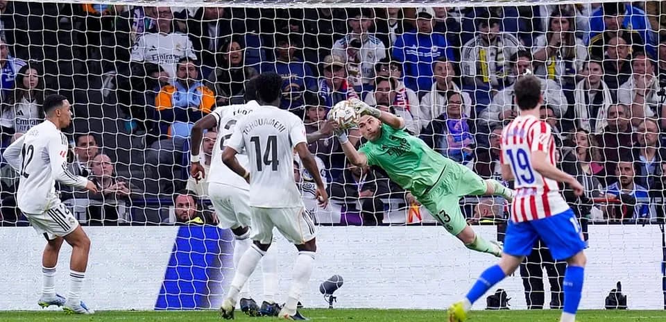 Goalkeeper saving a penalty during Madrid derby