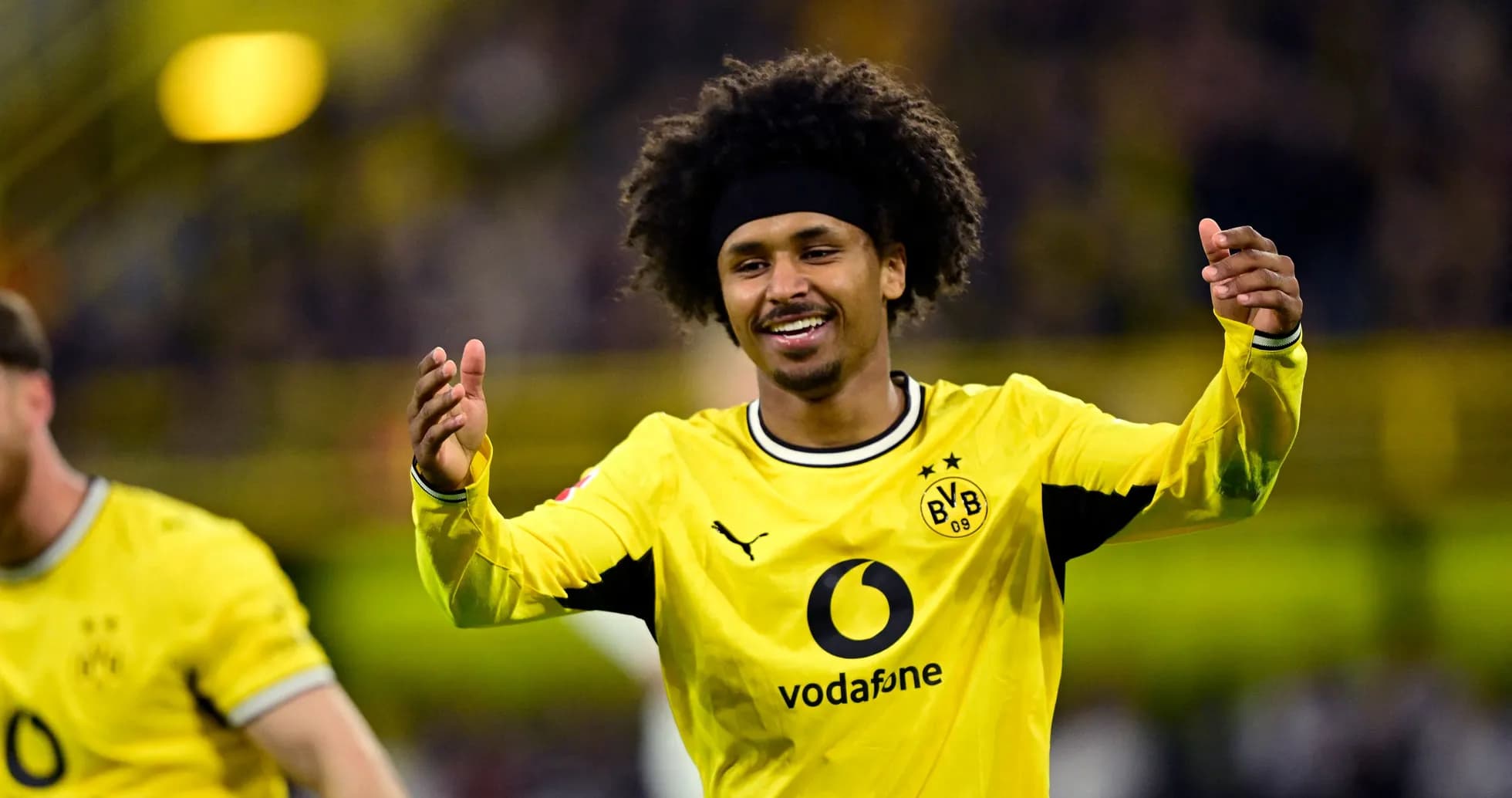Player celebrating in Borussia Dortmund jersey