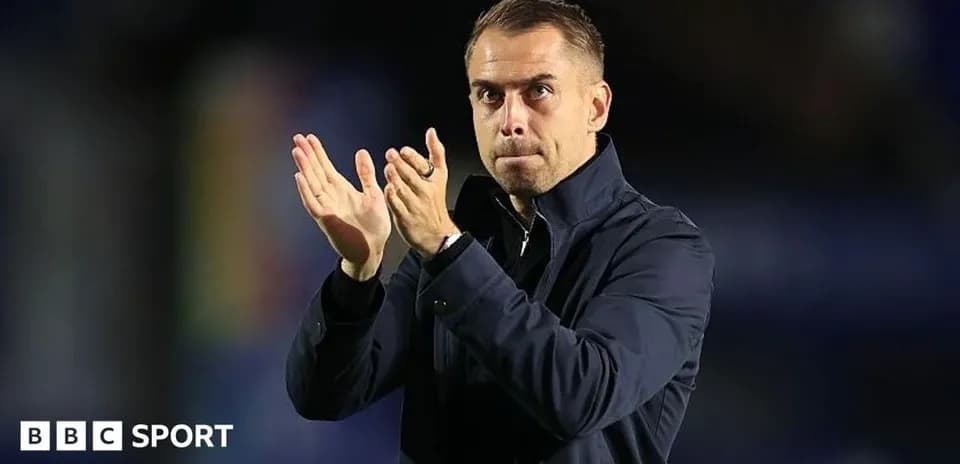 Coach applauding during a match celebration